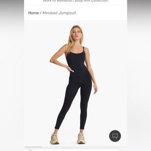 Black Vuori women’s onesie, never worn, brand new without tags